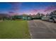 Charming home with a lush green lawn, well-maintained landscaping, and ample parking at 6530 Manila Palm Way, Apollo Beach, FL 33572