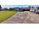 Charming single-story home with a spacious driveway and manicured landscaping at 6530 Manila Palm Way, Apollo Beach, FL 33572