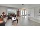 Bright living room featuring hardwood floors, natural light, and elegant decor at 6530 Manila Palm Way, Apollo Beach, FL 33572