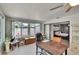Office with large windows providing natural light, wood floors, sliding door to bedroom, and storage cabinet at 6530 Manila Palm Way, Apollo Beach, FL 33572