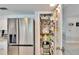 Walk-in pantry with adjustable wire shelving and stainless steel refrigerator at 6530 Manila Palm Way, Apollo Beach, FL 33572