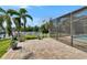 View from the brick paver patio of the screened in lanai and the canal with dock at 6530 Manila Palm Way, Apollo Beach, FL 33572