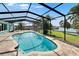 Inviting pool with a screened enclosure offering privacy and scenic water views at 6530 Manila Palm Way, Apollo Beach, FL 33572