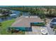 A waterfront home featuring a large yard, boat dock, and an enclosed pool at 6530 Manila Palm Way, Apollo Beach, FL 33572
