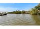 Picturesque view of the waterway with boat docks across the canal at 6530 Manila Palm Way, Apollo Beach, FL 33572