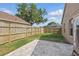 Backyard with brick patio, lawn, and fenced perimeter at 6623 Northhaven Ct, Riverview, FL 33578