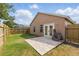 Backyard features a brick patio, lawn, and fenced perimeter at 6623 Northhaven Ct, Riverview, FL 33578