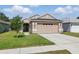 Charming single-Gathering home with a well-maintained lawn and a two-car garage, perfect for suburban living at 6623 Northhaven Ct, Riverview, FL 33578