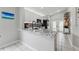 Stylish kitchen with modern white cabinets, granite countertops, and stainless steel appliances, perfect for cooking at 6623 Northhaven Ct, Riverview, FL 33578