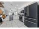 Modern kitchen features stainless steel appliances, white cabinetry, and a sleek design, perfect for home chefs at 6623 Northhaven Ct, Riverview, FL 33578