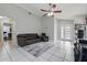 Comfortable living area showcasing tile floors, a ceiling fan, and a neutral color scheme, creating a cozy space at 6623 Northhaven Ct, Riverview, FL 33578