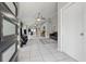 Bright, open-concept living area with tile flooring and a view of the dining and kitchen spaces at 6623 Northhaven Ct, Riverview, FL 33578