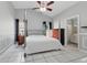 Spacious bedroom featuring high ceilings, tile floors, and ensuite bathroom with updated fixtures at 6623 Northhaven Ct, Riverview, FL 33578