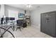 Functional office space with sleek desk, computer setup, and a large Liberty safe for secure storage at 6623 Northhaven Ct, Riverview, FL 33578