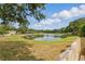 Scenic view of a pond surrounded by lush greenery at 6623 Northhaven Ct, Riverview, FL 33578