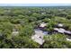 Discover this community aerial view nestled among lush greenery, offering a serene and private living experience at 706 1St Ct, Palm Harbor, FL 34684