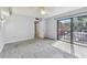 A bright bedroom has carpeting, ceiling fan and a closet at 706 1St Ct, Palm Harbor, FL 34684