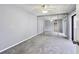 Bedroom featuring mirrored closet doors and neutral carpeting at 706 1St Ct, Palm Harbor, FL 34684