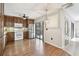 Well-lit kitchen features stainless steel appliances, wood cabinets, and a stylish backsplash at 706 1St Ct, Palm Harbor, FL 34684