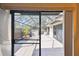 A covered patio includes tile flooring and a spa at 706 1St Ct, Palm Harbor, FL 34684