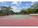 View of a community tennis court on a sunny day at 706 1St Ct, Palm Harbor, FL 34684