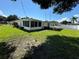 Features a backyard with both an enclosed patio and a covered patio at 7102 Reindeer Rd, Tampa, FL 33619