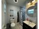 Cozy bathroom features a stylish vanity, a shower with a curtain, and modern fixtures at 7102 Reindeer Rd, Tampa, FL 33619