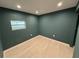 This spacious bedroom features modern tile flooring and natural light from the window at 7102 Reindeer Rd, Tampa, FL 33619
