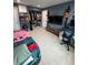 A nicely sized bedroom with a full closet, shelving, and neutral tile flooring at 7102 Reindeer Rd, Tampa, FL 33619