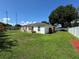 Well-maintained home shows off its spacious yard and modern fence, perfect for outdoor enjoyment at 7102 Reindeer Rd, Tampa, FL 33619