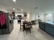 Open-concept kitchen and dining area with stainless steel appliances and views of the living room at 7102 Reindeer Rd, Tampa, FL 33619