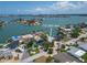 Waterfront home with beautiful landscaping, a private dock, and an inviting pool, offering serene water views at 719 59Th Ave, St Pete Beach, FL 33706