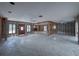 Spacious living room with a ceiling fan, large windows, and an open layout, ready for your creative design at 719 59Th Ave, St Pete Beach, FL 33706