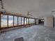 Spacious living room with a wall of windows and ceiling fans at 719 59Th Ave, St Pete Beach, FL 33706