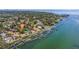 Waterfront homes with private docks and lush landscaping, providing serene bay access at 7235 Sunshine S Dr, St Petersburg, FL 33705
