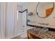 Stylish bathroom featuring modern fixtures, glass bowl sink, and tiled shower-tub combo at 7235 Sunshine S Dr, St Petersburg, FL 33705