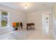 Versatile bonus room with ample natural light, desk area, and a neutral color palette at 7235 Sunshine S Dr, St Petersburg, FL 33705