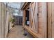 Exterior view of backyard wooden chicken coop with fenced run on gravel at 7235 Sunshine S Dr, St Petersburg, FL 33705
