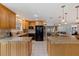 Open kitchen with granite countertops, stainless appliances, and a large center island at 7235 Sunshine S Dr, St Petersburg, FL 33705