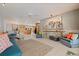 Expansive living space with tile floors, ceiling fan, and seating at 7235 Sunshine S Dr, St Petersburg, FL 33705