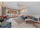 Inviting living room with tile floors, a ceiling fan, and access to the pool at 7235 Sunshine S Dr, St Petersburg, FL 33705