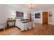 Relaxing bedroom with hardwood floors, wood trim doors, and chandelier at 7235 Sunshine S Dr, St Petersburg, FL 33705