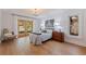 Charming main bedroom featuring hardwood floors, backyard view, and chandelier at 7235 Sunshine S Dr, St Petersburg, FL 33705