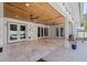 Expansive covered patio leading to an inviting pool and landscaped outdoor area at 7235 Sunshine S Dr, St Petersburg, FL 33705