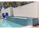 Beautiful view of a backyard swimming pool, featuring blue tile trim and a tranquil design at 7235 Sunshine S Dr, St Petersburg, FL 33705
