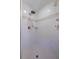 Neutral shower with stone walls, tiled floors, and updated hardware at 7235 Sunshine S Dr, St Petersburg, FL 33705