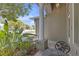Cozy front porch with ornate table, greenery, and decorative columns for curb appeal at 7246 Julian St, New Port Richey, FL 34653