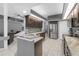 Modern kitchen featuring granite countertops, stainless steel appliances, and a convenient breakfast bar at 7246 Julian St, New Port Richey, FL 34653