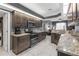 Modern kitchen featuring granite countertops, stainless steel appliances, and ample cabinet space at 7246 Julian St, New Port Richey, FL 34653