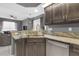 Lovely kitchen featuring granite countertops, stainless steel appliances, and a view to the living area at 7246 Julian St, New Port Richey, FL 34653